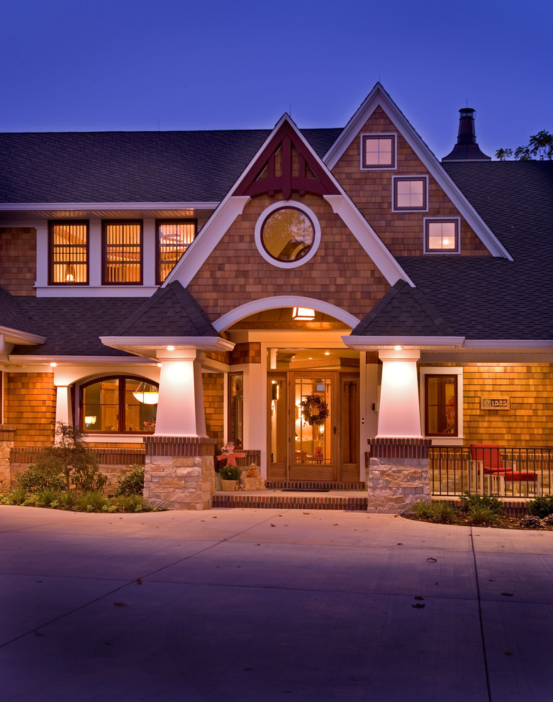 Traditional two-storey exterior in Chicago with wood siding and a gable roof.
