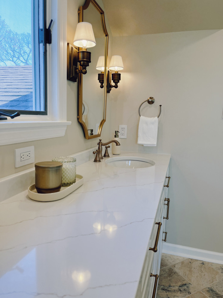 Inspiration for a large transitional master white tile and ceramic tile travertine floor, beige floor and double-sink freestanding bathtub remodel with shaker cabinets, white cabinets, a two-piece toilet, beige walls, an undermount sink, quartz countertops, a hinged shower door, white countertops and a built-in vanity