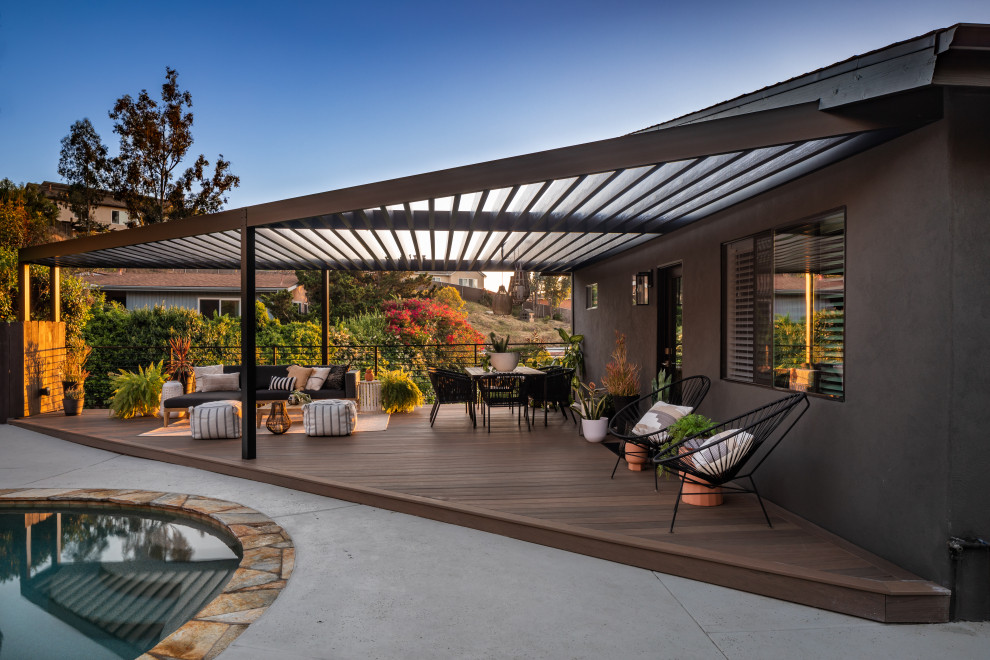 Inspiration for a large midcentury two-storey black exterior in San Diego.