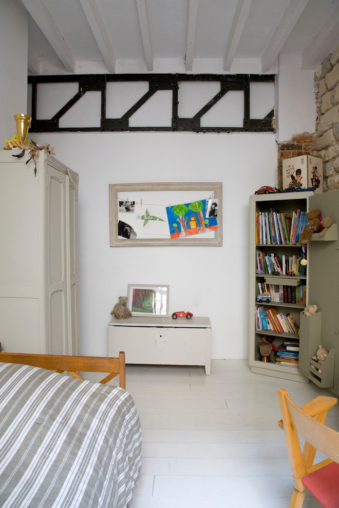 Design ideas for an industrial kids' room in Paris with white walls and painted wood floors.