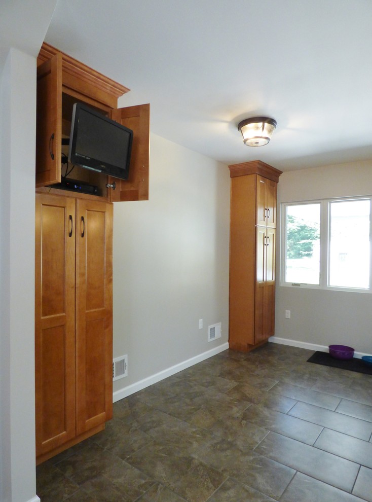 Example of a transitional l-shaped porcelain tile eat-in kitchen design with an undermount sink, recessed-panel cabinets, medium tone wood cabinets, quartz countertops, white backsplash, subway tile backsplash, stainless steel appliances and an island