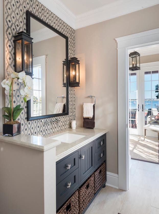 Inspiration for a mid-sized beach style bathroom in Providence with shaker cabinets, black cabinets, gray tile, ceramic tile, beige walls, porcelain floors, an undermount sink and limestone benchtops.