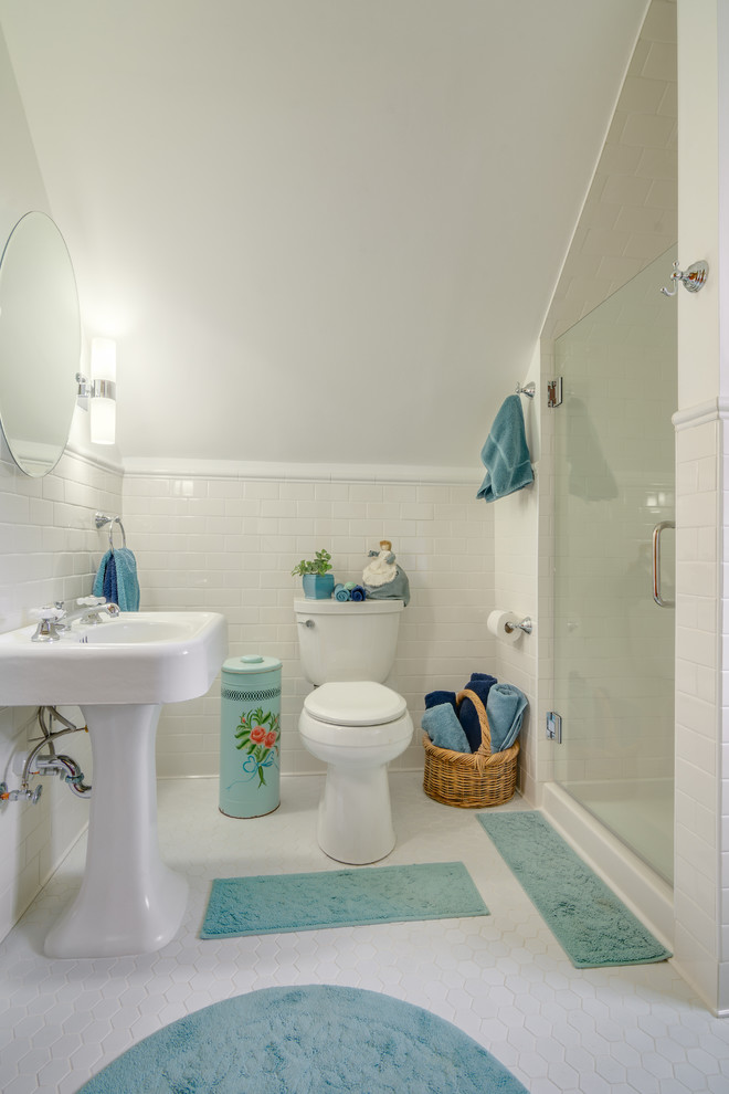 Photo of a mid-sized traditional bathroom in Other with a pedestal sink, an alcove shower, a two-piece toilet, white tile, ceramic tile, white walls and ceramic floors.