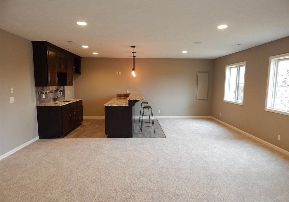 Example of a mountain style home design design in Omaha