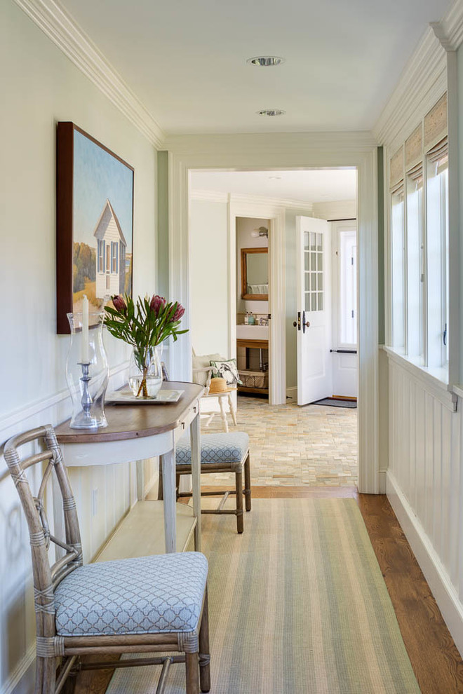 This is an example of a mid-sized beach style hallway in Boston with medium hardwood floors and green walls.