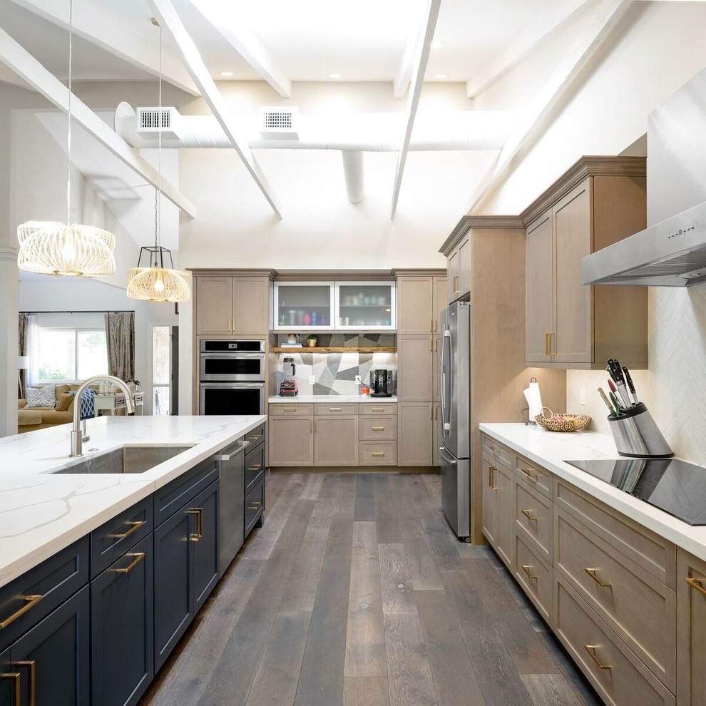 Inspiration for a large contemporary l-shaped eat-in kitchen in Phoenix with an undermount sink, shaker cabinets, blue cabinets, quartz benchtops, multi-coloured splashback, porcelain splashback, stainless steel appliances, medium hardwood floors, with island and multi-coloured floor.