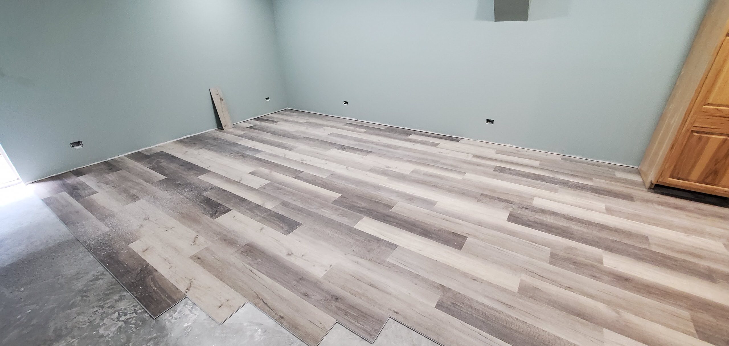 Finished basement Duralux Performance vinyl plank flooring in progress
