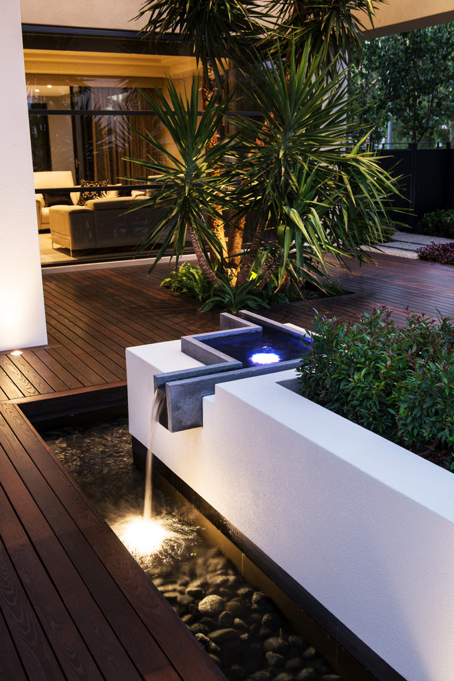 This is an example of a contemporary deck in Perth with a water feature and no cover.