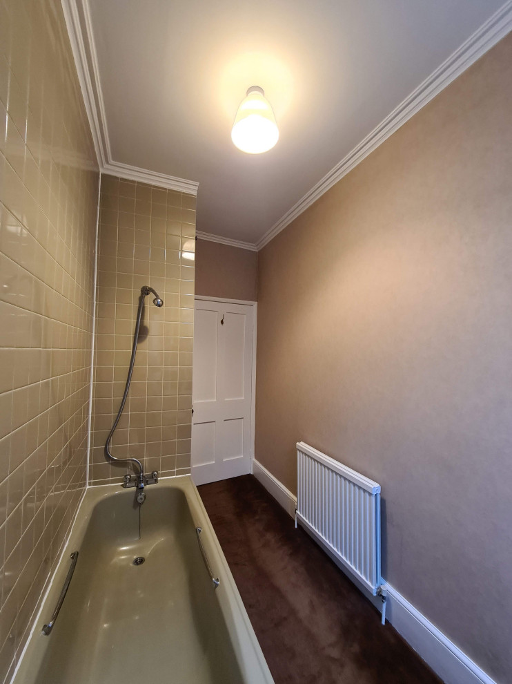 Inspiration for a medium sized traditional ensuite bathroom in London with white cabinets, a built-in bath, an alcove shower, a one-piece toilet, beige tiles, ceramic tiles, beige walls, a pedestal sink, a shower curtain, a single sink, a freestanding vanity unit, a coffered ceiling and wallpapered walls.