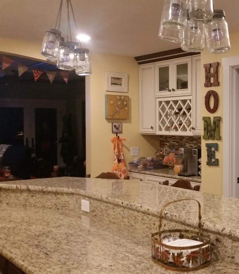 Inspiration for a transitional enclosed kitchen remodel in Orange County with granite countertops and a peninsula