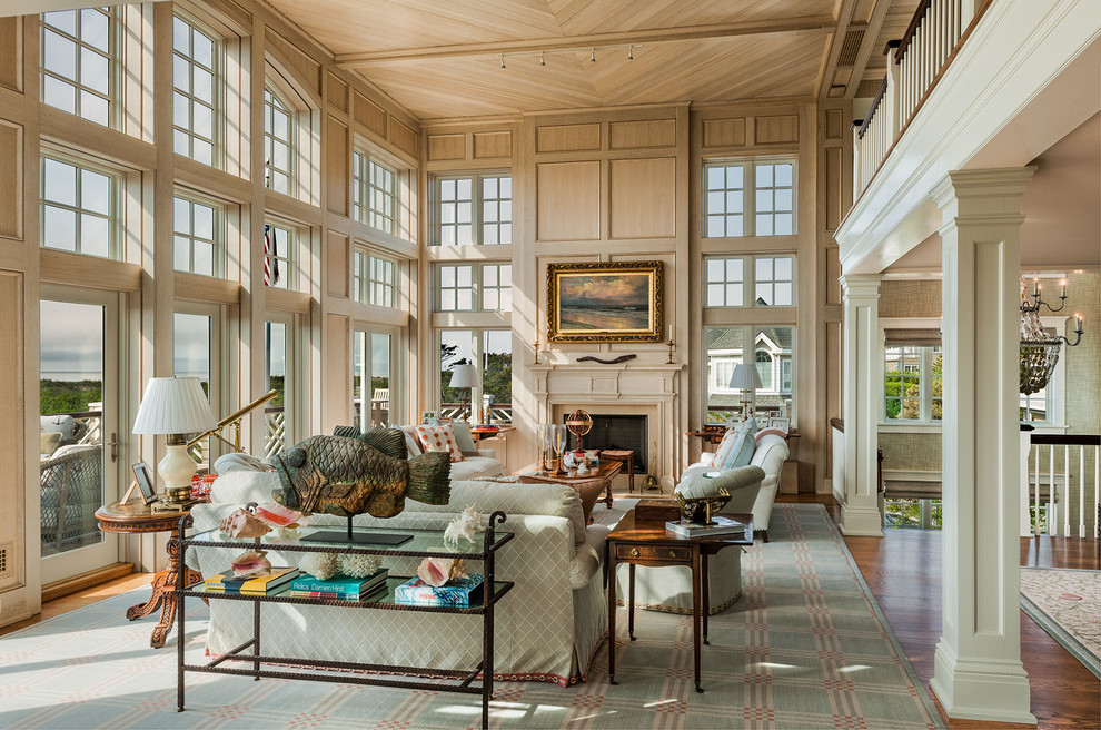Inspiration for a timeless formal and open concept medium tone wood floor living room remodel in Philadelphia with beige walls, a standard fireplace and no tv
