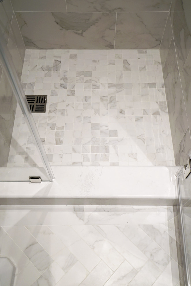 Inspiration for a small traditional master bathroom in New York with an alcove shower, a one-piece toilet, white tile, porcelain tile, white walls, porcelain floors and a pedestal sink.