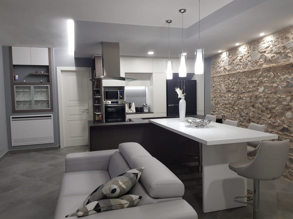 Design ideas for a large contemporary galley open plan kitchen in Catania-Palermo with an undermount sink, flat-panel cabinets, white cabinets, solid surface benchtops, white splashback, engineered quartz splashback, coloured appliances, porcelain floors, with island, grey floor, brown benchtop and recessed.