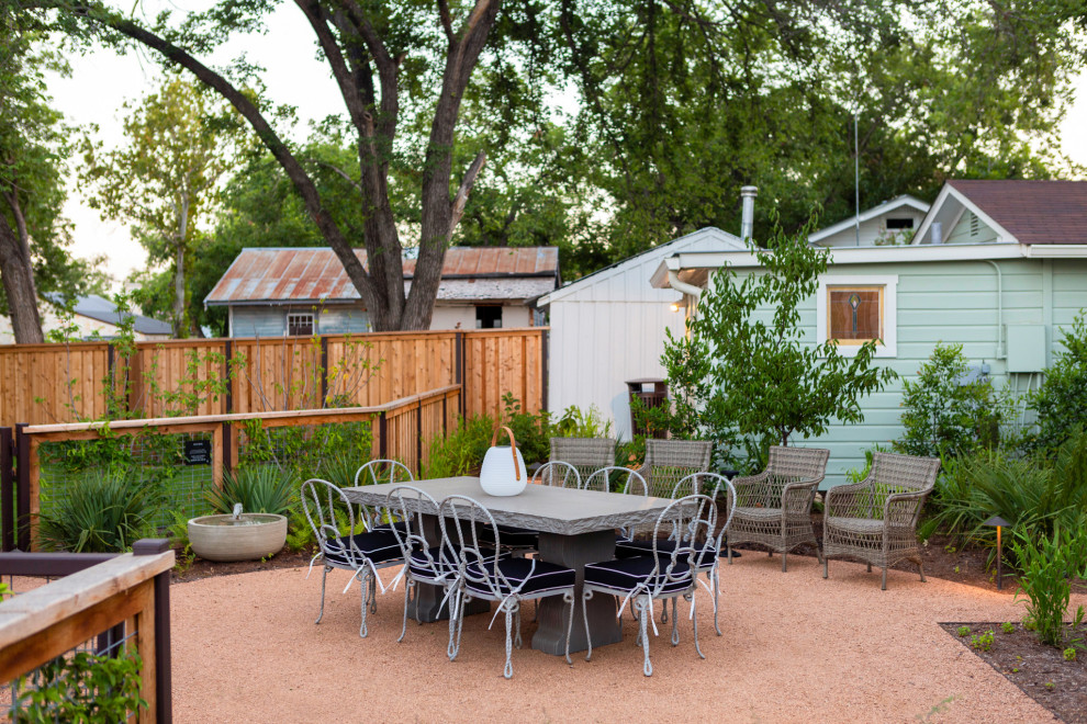 This is an example of an eclectic patio in Austin with decomposed granite.