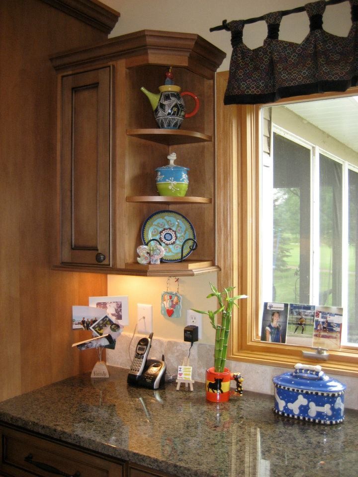 Example of a mid-sized transitional l-shaped dark wood floor open concept kitchen design in Milwaukee with a double-bowl sink, recessed-panel cabinets, dark wood cabinets, beige backsplash, stone tile backsplash, stainless steel appliances, an island and granite countertops