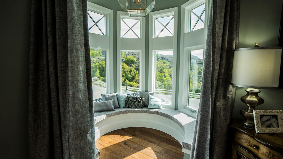 Inspiration for a mid-sized transitional master bedroom in Salt Lake City with dark hardwood floors and brown floor.