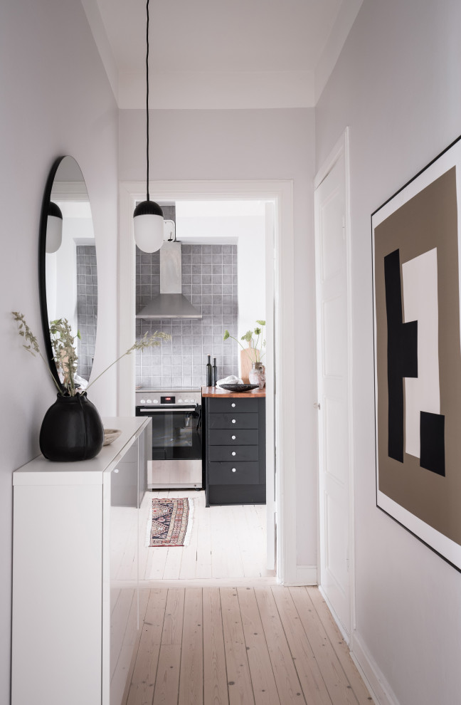 Design ideas for a mid-sized scandinavian hallway in Gothenburg with grey walls and beige floor.