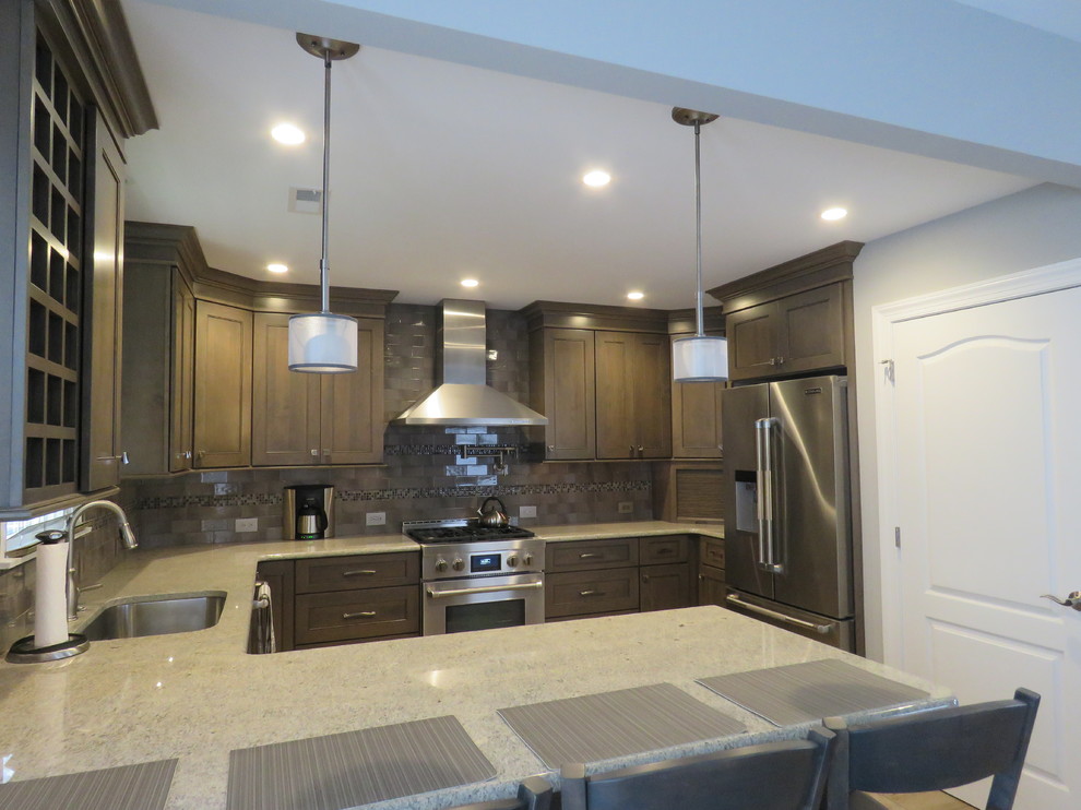 Inspiration for a mid-sized transitional u-shaped ceramic tile and beige floor eat-in kitchen remodel in Philadelphia with an undermount sink, shaker cabinets, gray cabinets, quartzite countertops, gray backsplash, subway tile backsplash, stainless steel appliances and an island