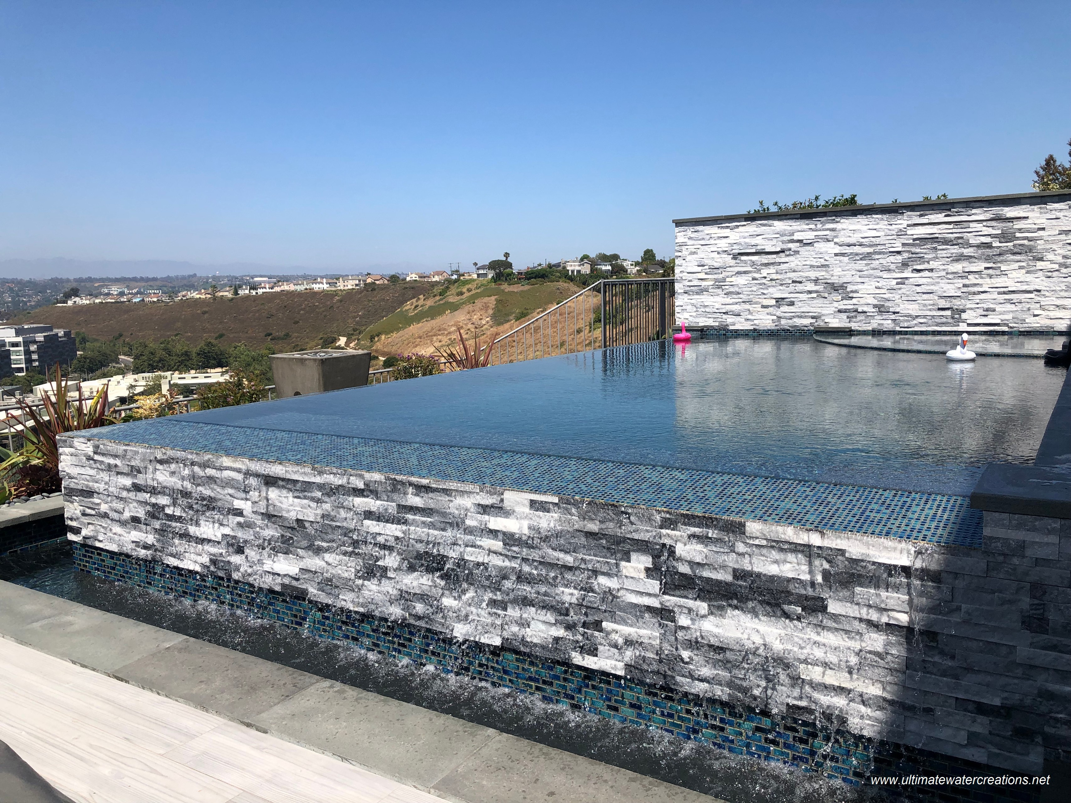 Los Angeles -  Contemporary Hillside Pool & Spa with Colored Water Spillways