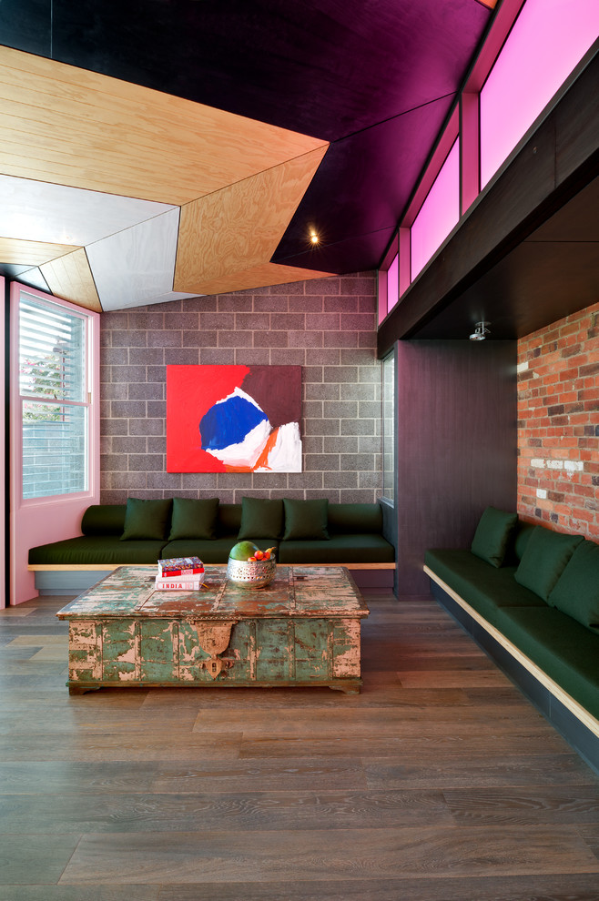 Inspiration for a large contemporary open concept living room in Melbourne with medium hardwood floors and multi-coloured walls.