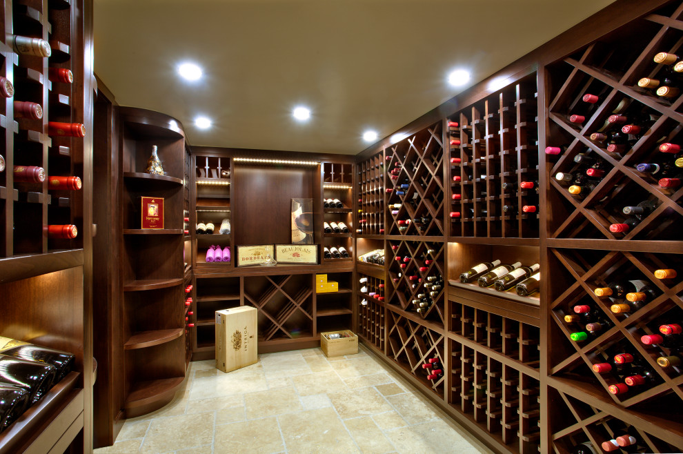Design ideas for a mid-sized traditional wine cellar in Montreal with beige floor.