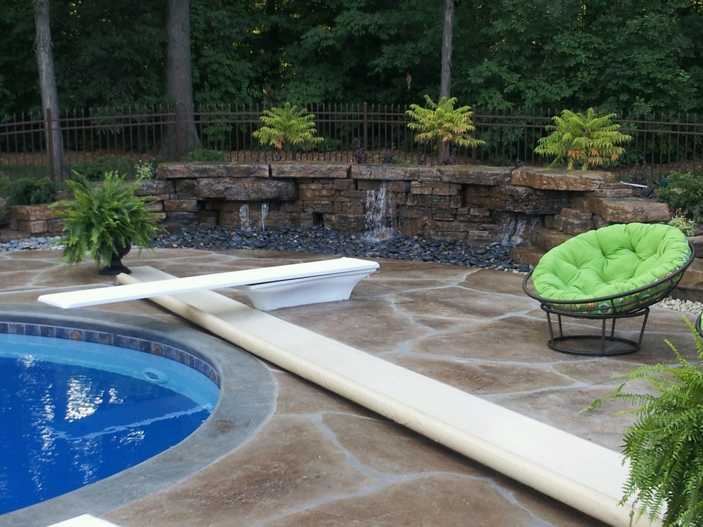 Pool - mid-sized transitional backyard stone and custom-shaped lap pool idea