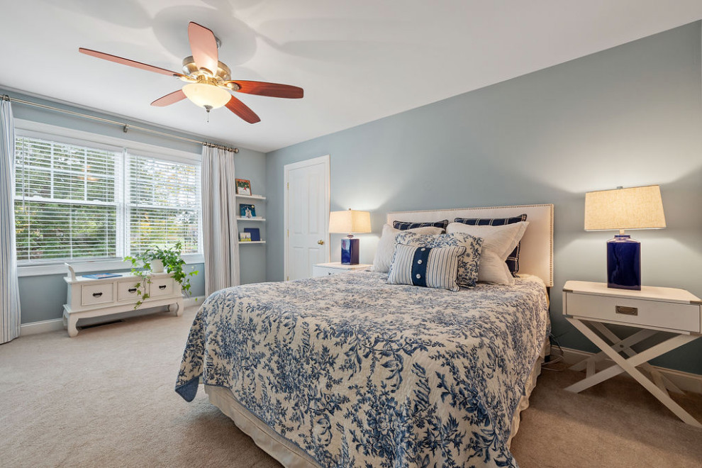 Inspiration for a mid-sized transitional guest bedroom in Boston with blue walls, carpet and beige floor.