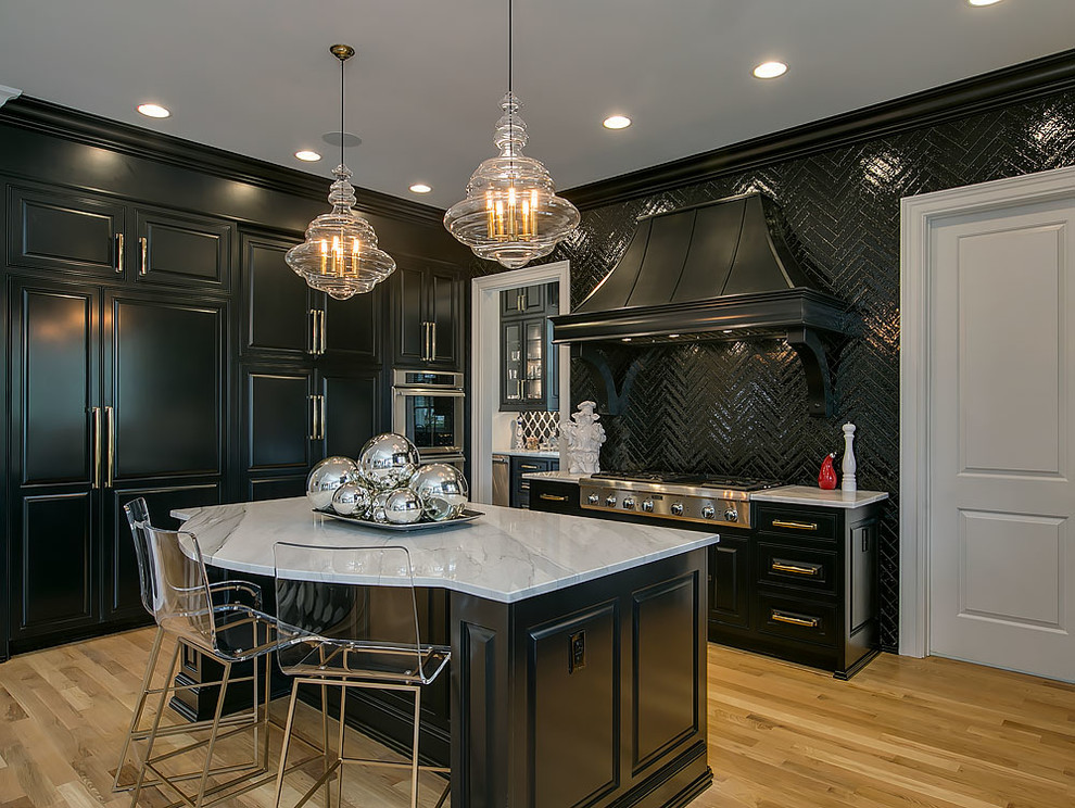 Inspiration for a traditional separate kitchen in Raleigh with raised-panel cabinets, black cabinets, black splashback, light hardwood floors, with island, beige floor, granite benchtops and panelled appliances.