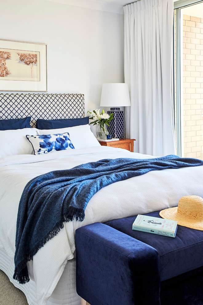 Inspiration for a mid-sized contemporary master bedroom in Sydney with white walls, carpet and beige floor.