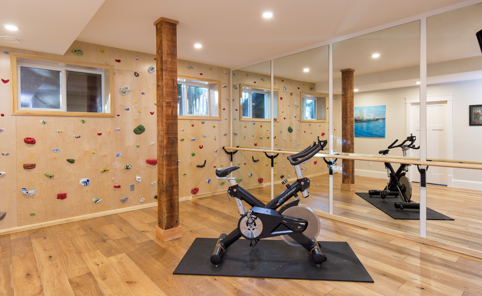 Traditional home gym in Vancouver with light hardwood floors.