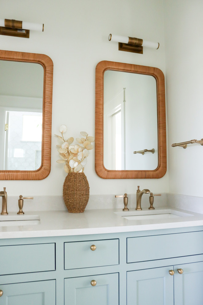 Beach style 3/4 double-sink bathroom photo in Houston with shaker cabinets, turquoise cabinets, white walls, an undermount sink, quartz countertops, gray countertops and a built-in vanity
