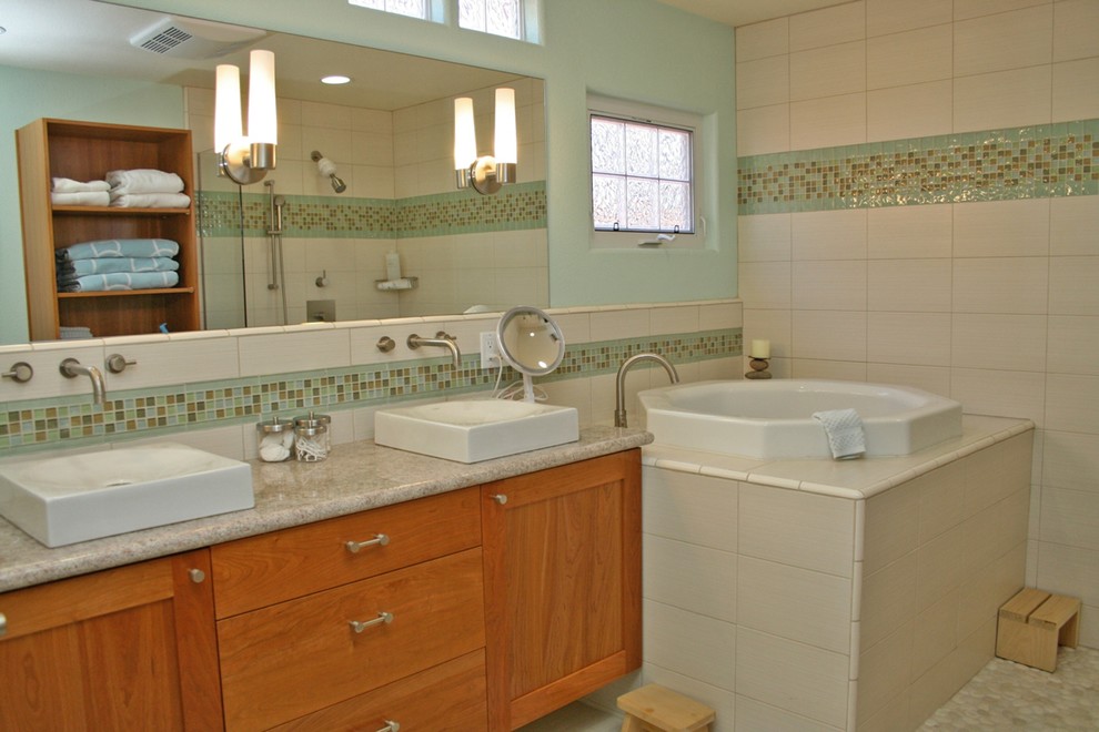 Mid-sized transitional white tile and ceramic tile porcelain tile bathroom photo in San Francisco with a vessel sink, shaker cabinets, medium tone wood cabinets, granite countertops and green walls