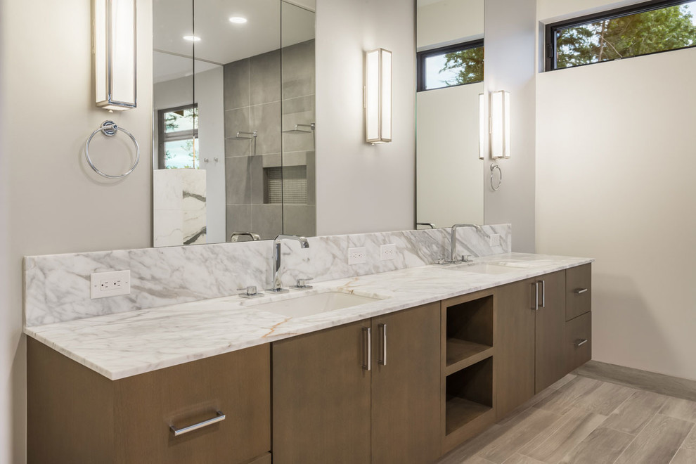 Inspiration for a mid-sized contemporary master bathroom in Seattle with flat-panel cabinets, brown cabinets, light hardwood floors, marble benchtops, brown floor and white benchtops.