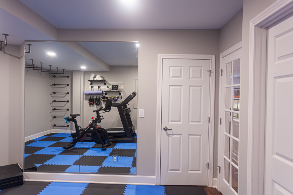 Design ideas for a mid-sized transitional multipurpose gym in Cincinnati with grey walls, travertine floors and multi-coloured floor.