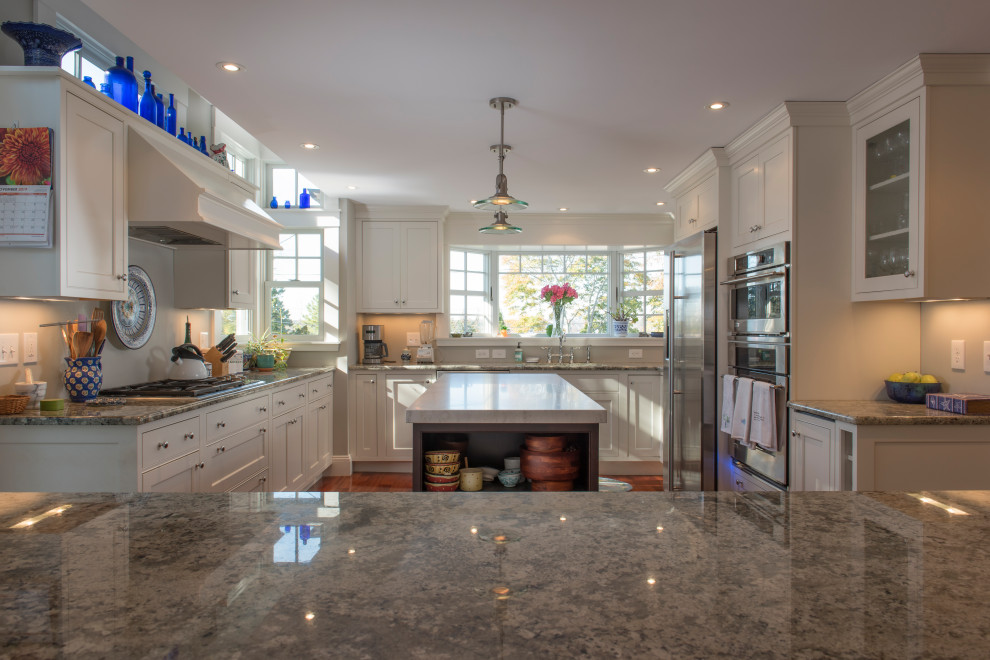 Large transitional u-shaped medium tone wood floor eat-in kitchen photo in Boston with beaded inset cabinets, white cabinets, granite countertops, white backsplash, stainless steel appliances, an island and gray countertops
