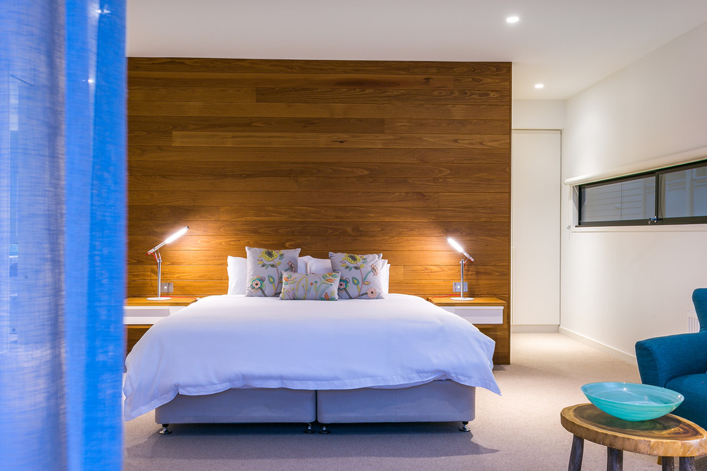 This is an example of a large contemporary master bedroom in Melbourne.