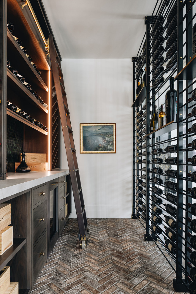 Photo of a contemporary wine cellar in Chicago with storage racks and brown floors.