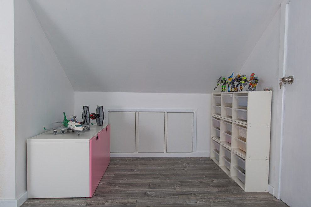 Design ideas for a mid-sized contemporary gender-neutral kids' room in Perth with white walls and vinyl floors.