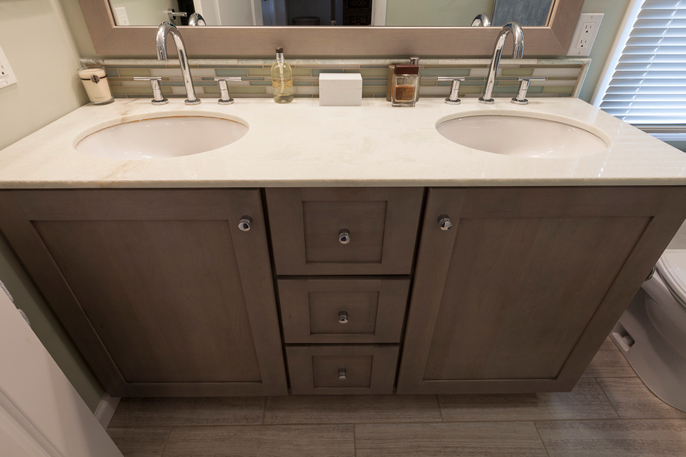 Design ideas for a small eclectic master bathroom in Bridgeport with an undermount sink, recessed-panel cabinets, grey cabinets, marble benchtops, an alcove shower, a two-piece toilet, gray tile, porcelain tile, grey walls and porcelain floors.