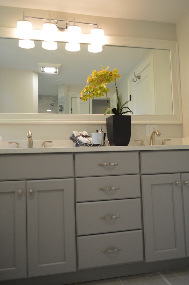 Mid-sized transitional master beige tile and cement tile bathroom photo in Boston with a hot tub, an undermount sink, beige countertops, recessed-panel cabinets, gray cabinets and quartzite countertops