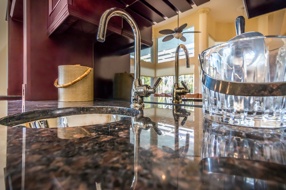 Example of a transitional home bar design in Miami
