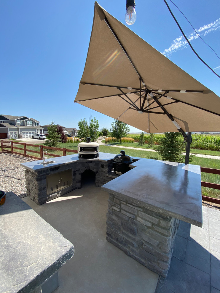 Rustic Reverie: Custom Concrete and Stone Unite in Your Outdoor Culinary Haven