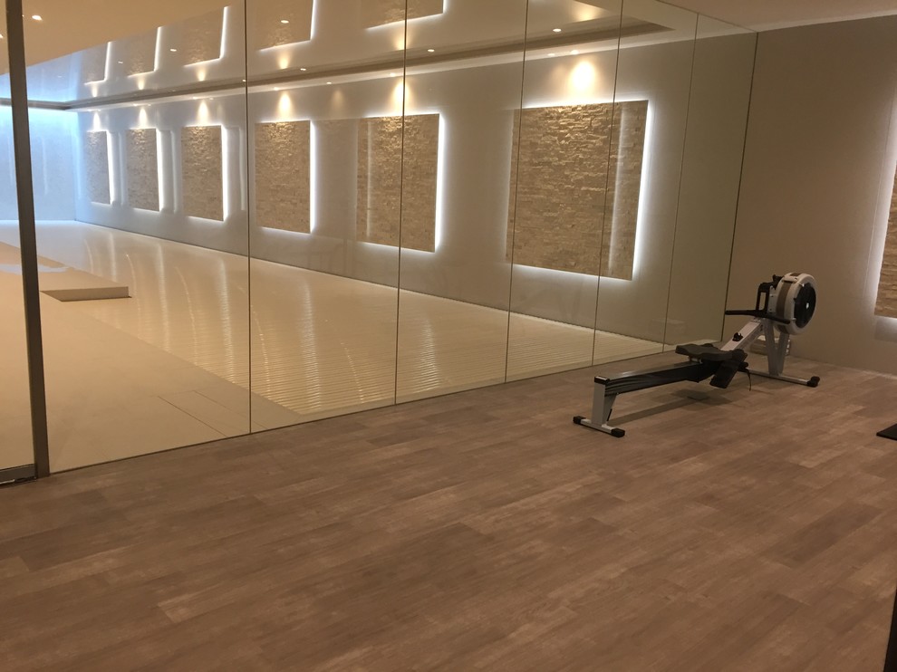 Large contemporary home gym in Surrey.