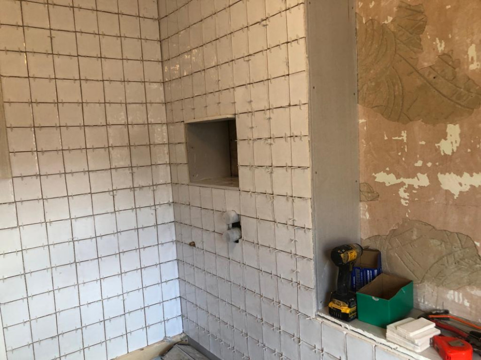 Toiletries pigeon hole created in shower cubicle in new stud wall