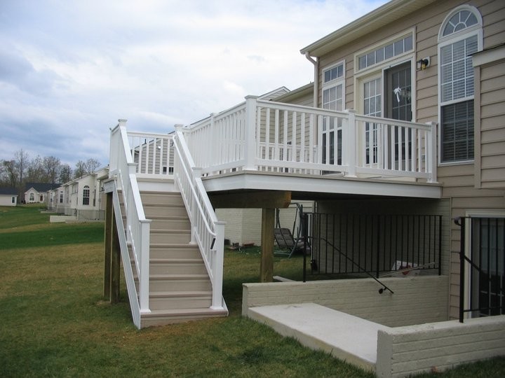 Inspiration for a mid-sized transitional backyard deck remodel in DC Metro with no cover