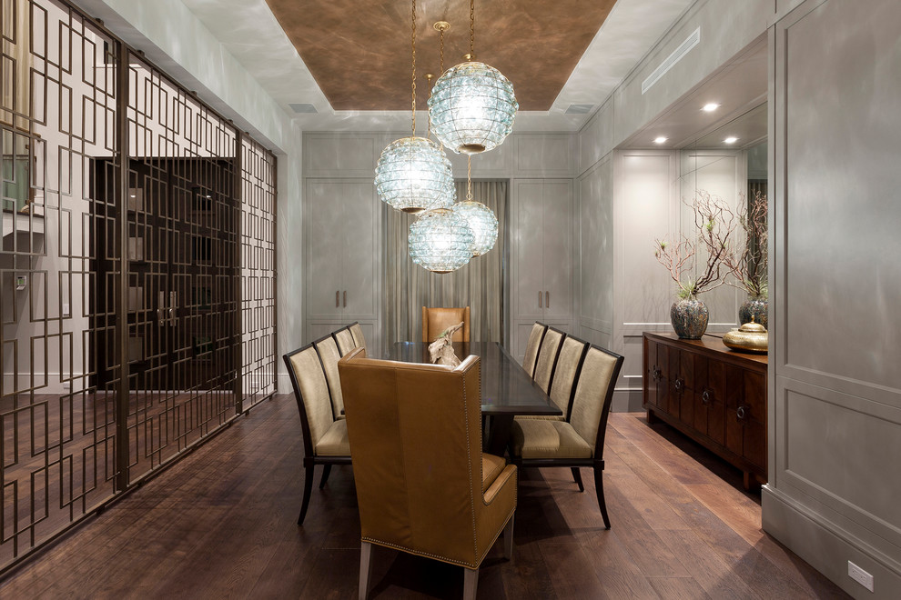 Inspiration for a transitional separate dining room in Miami with grey walls, dark hardwood floors and no fireplace.