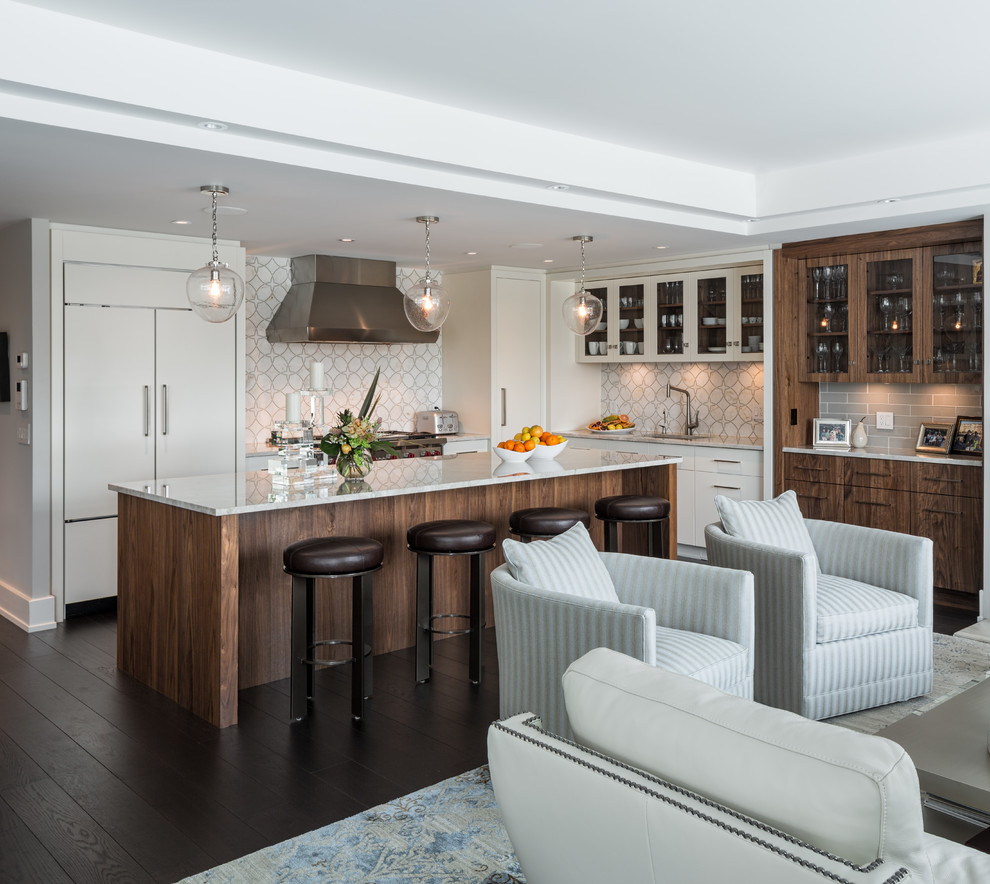 Inspiration for a mid-sized contemporary l-shaped dark wood floor eat-in kitchen remodel in Ottawa with an undermount sink, flat-panel cabinets, white cabinets, quartz countertops, white backsplash, mosaic tile backsplash, stainless steel appliances and an island
