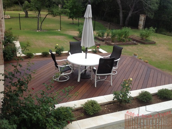 Ipe Hardwood Decking with Metal Framing, Limestone Flower Beds around ...