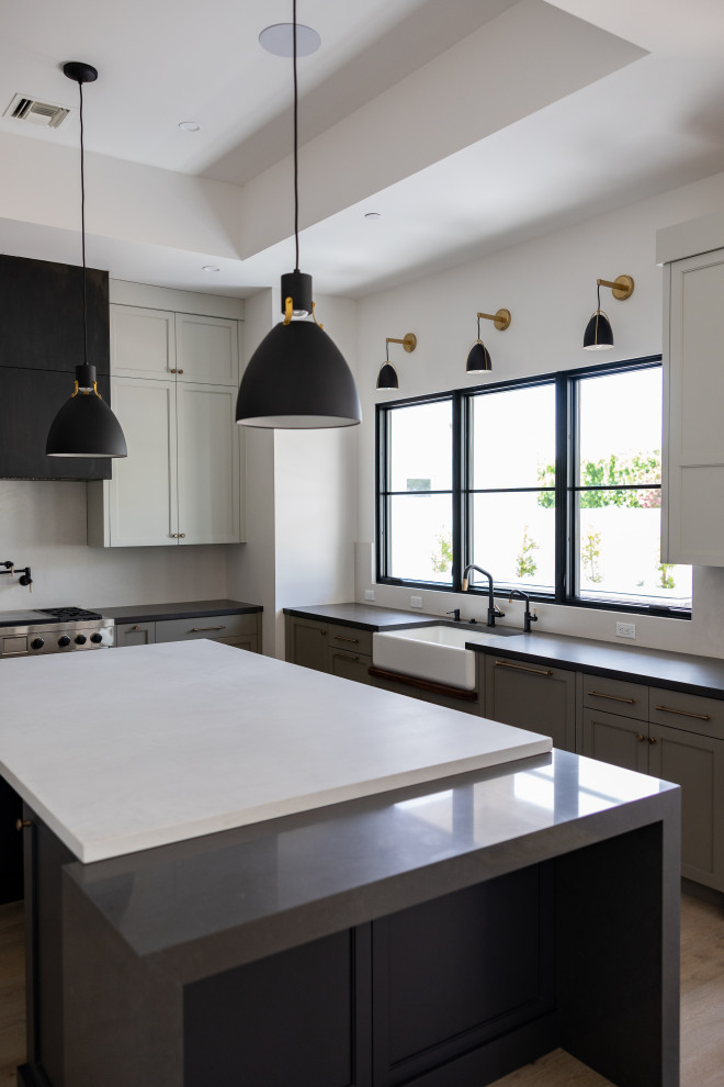 Open concept kitchen - large transitional galley open concept kitchen idea in Phoenix with an integrated sink, recessed-panel cabinets, gray cabinets, marble countertops, white backsplash, marble backsplash, paneled appliances, an island and white countertops