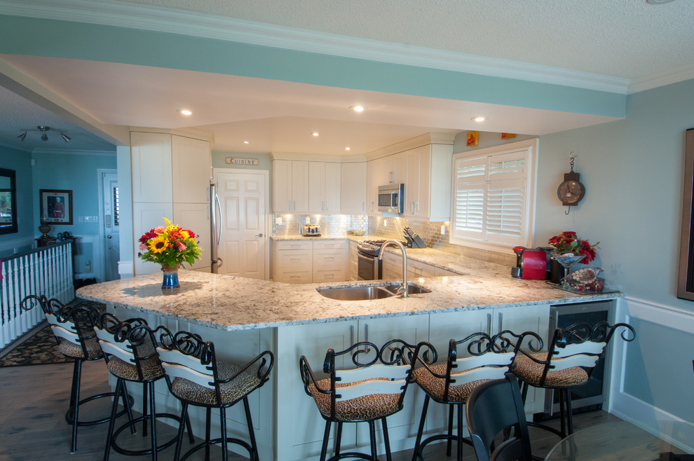 Example of a transitional kitchen design in Toronto